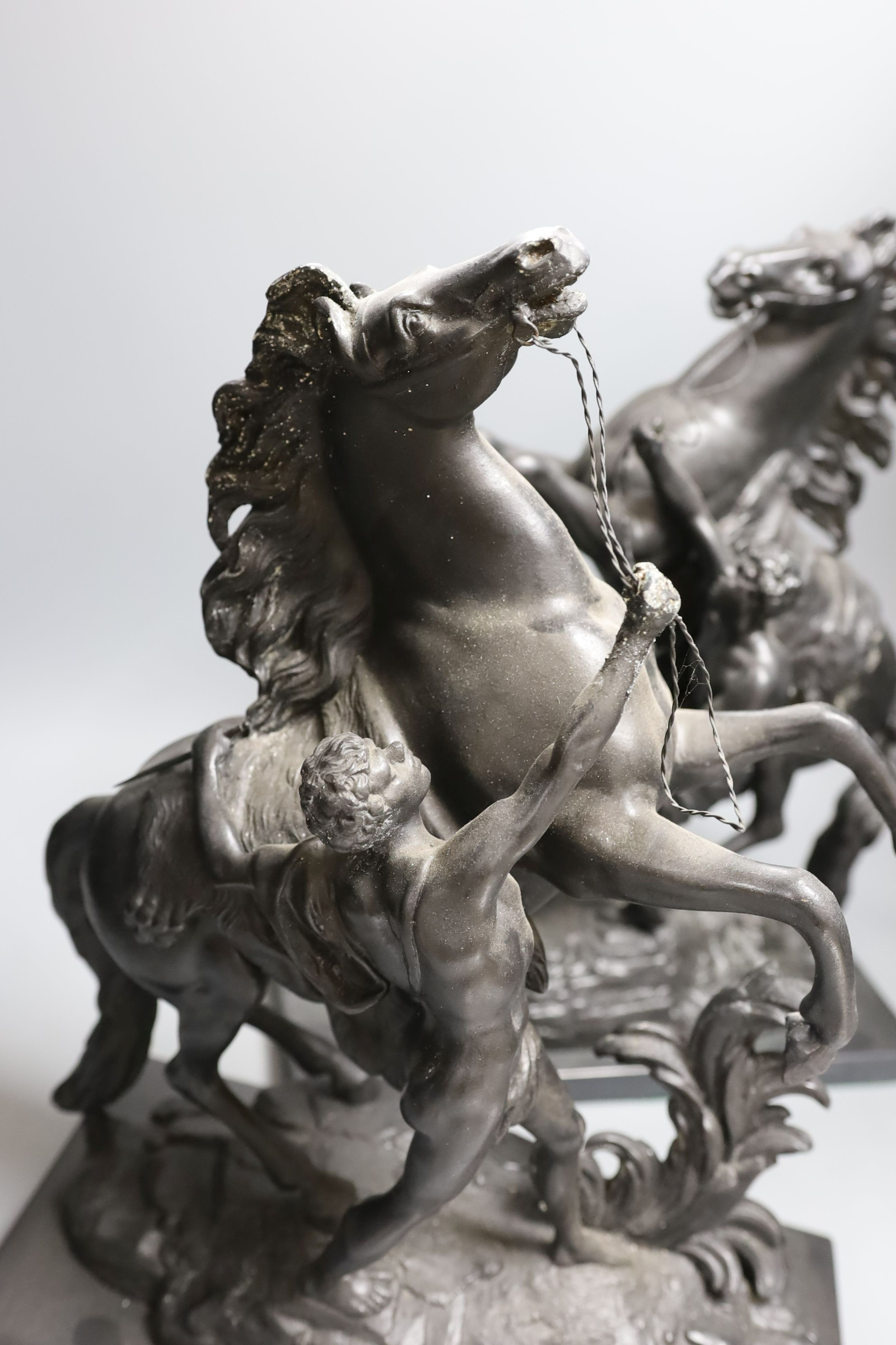 A pair of spelter Marly horse groups - 43cm tall